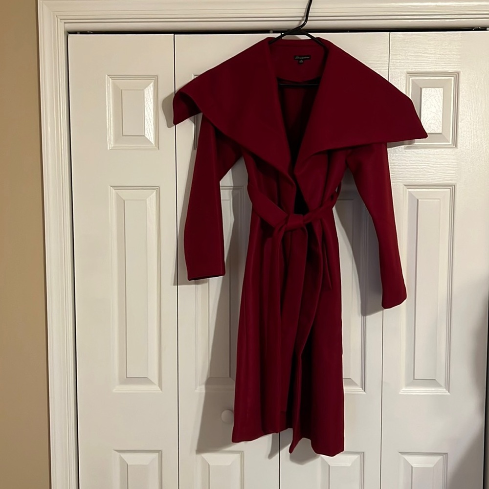 Red buttonless trench coat